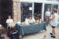 Dottie, her grandchilren, and daughter have food for riders at the first rest stop