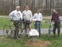 Cyclists at a Dutch mushroom signpost